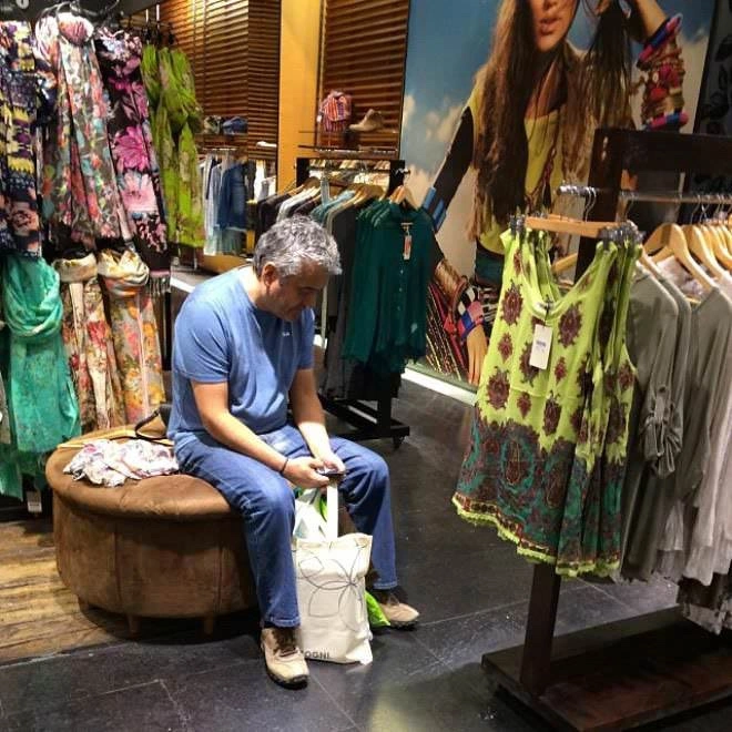 20 Heartbreaking Images of Men Forced to Endure Shopping Trips with Their Spouses