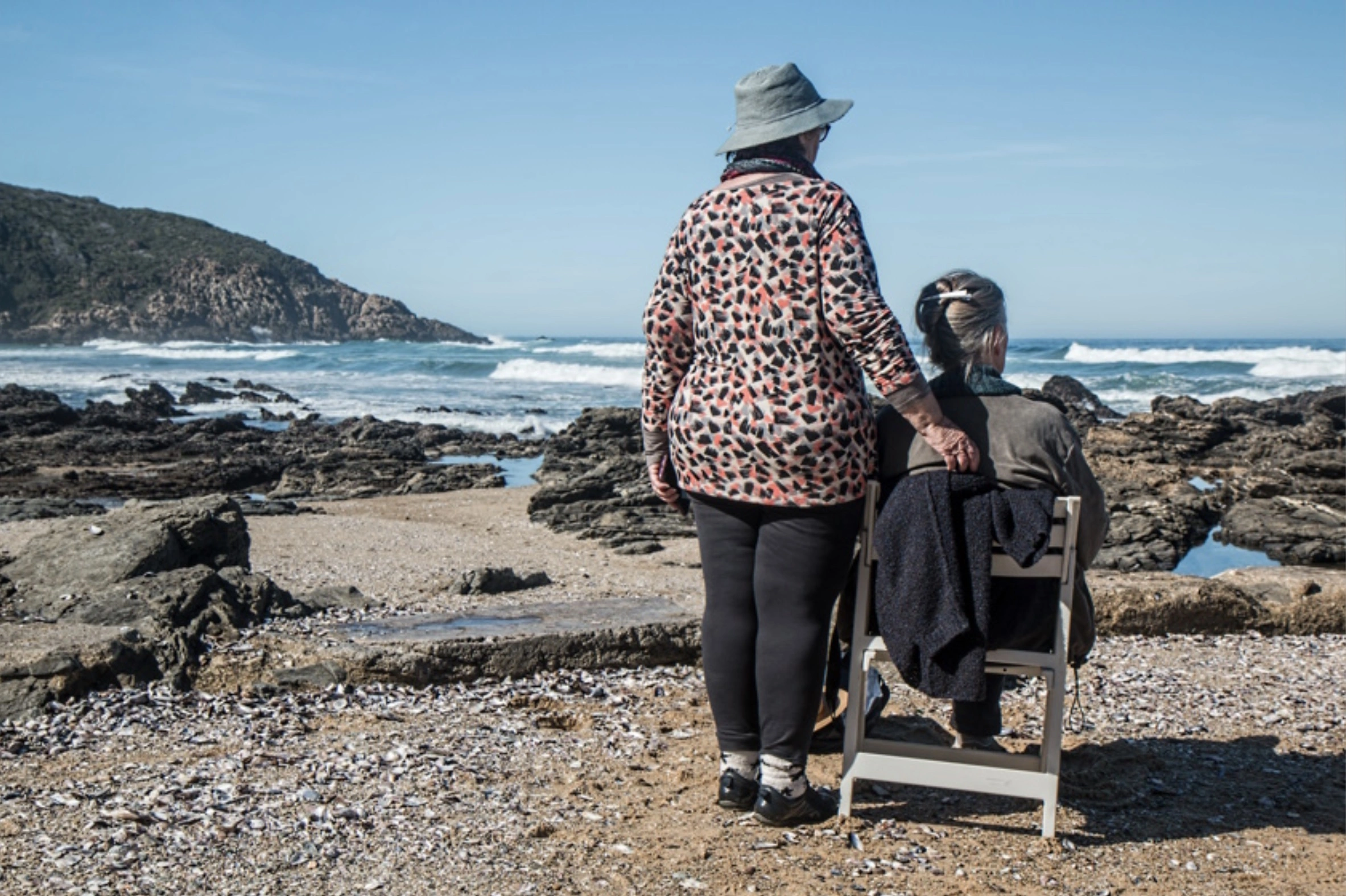 25 Healthcare Workers Preparing to Assist Elderly Individuals with Ocean Therapy