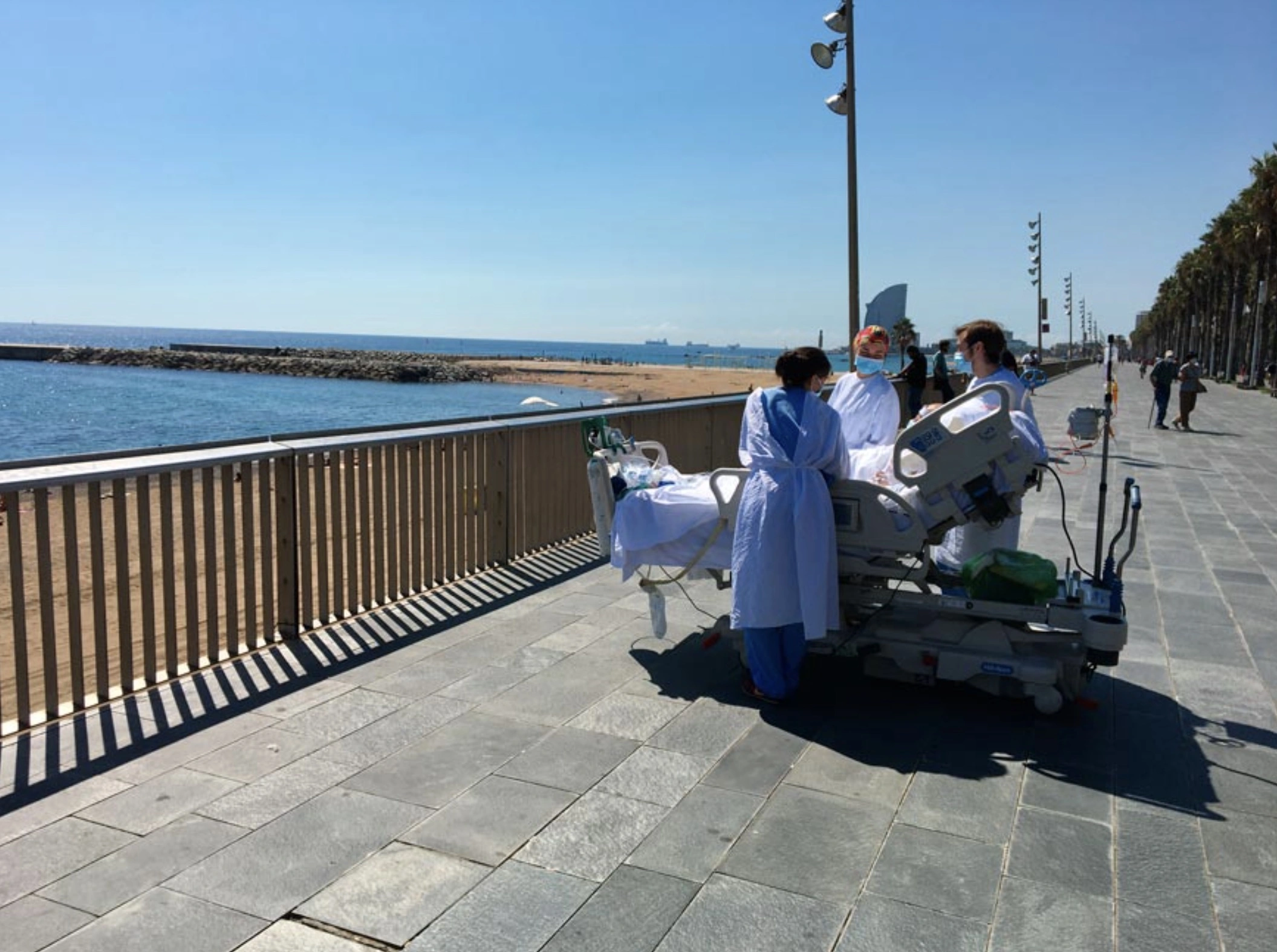 25 Healthcare Workers Preparing to Assist Elderly Individuals with Ocean Therapy